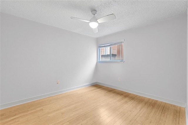 387 Ralph Mcgill Blvd NE Unit K, Atlanta, GA 30312 - spare room featuring light wood-style flooring, a ceiling fan, a textured ceiling, and baseboards