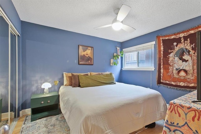 387 Ralph Mcgill Blvd NE Unit K, Atlanta, GA 30312 - bedroom with a textured ceiling, wood finished floors, a ceiling fan, and a closet