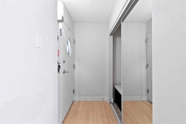 387 Ralph Mcgill Blvd NE Unit K, Atlanta, GA 30312 - hallway with light wood-style floors, a textured ceiling, and baseboards