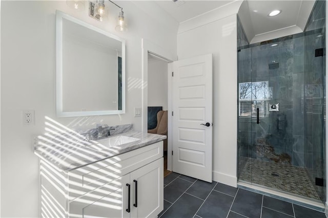 bathroom with vanity, tile patterned floors, and a shower with door