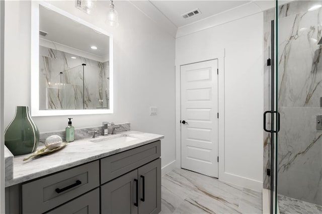 bathroom featuring ornamental molding, vanity, and a shower with door