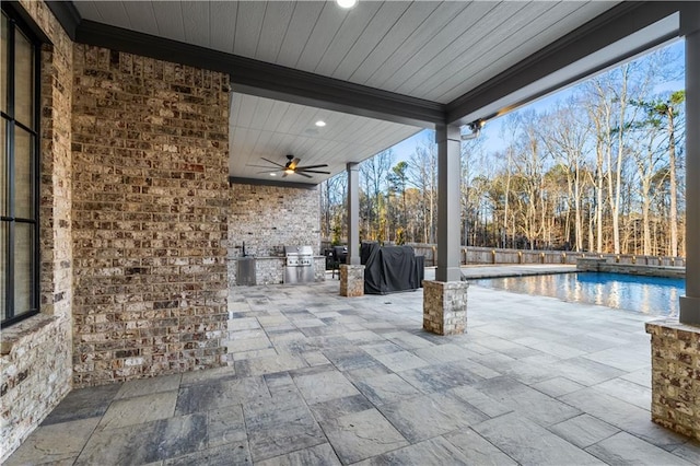 view of patio / terrace featuring ceiling fan and grilling area