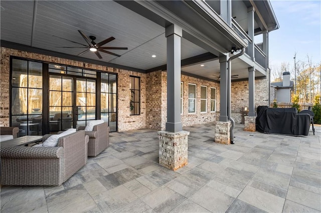 view of patio / terrace featuring a grill, ceiling fan, and outdoor lounge area