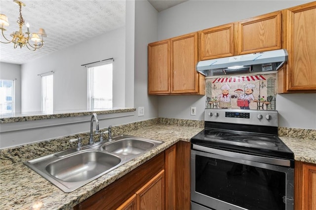 kitchen featuring sink, a textured ceiling, stainless steel electric range oven, light stone counters, and an inviting chandelier