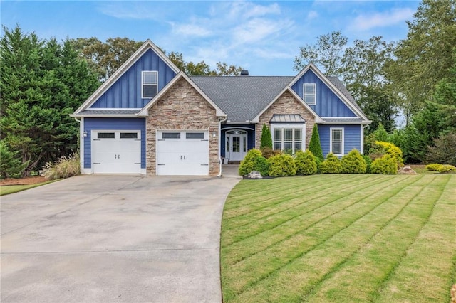 craftsman-style house with board and batten siding, driveway, a garage, a front lawn, and stone siding