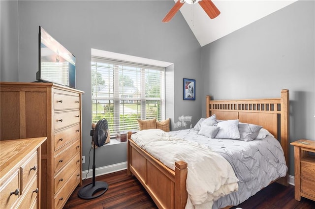 bedroom with baseboards, a ceiling fan, dark wood finished floors, and high vaulted ceiling