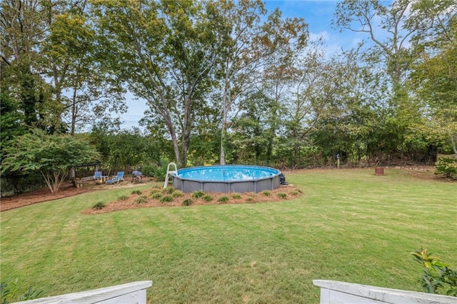 view of yard with an outdoor pool