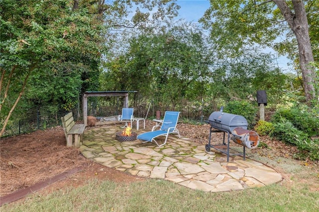view of patio featuring a grill and an outdoor fire pit