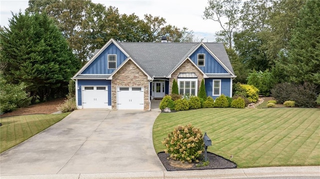 craftsman-style house with a front lawn, board and batten siding, stone siding, and concrete driveway