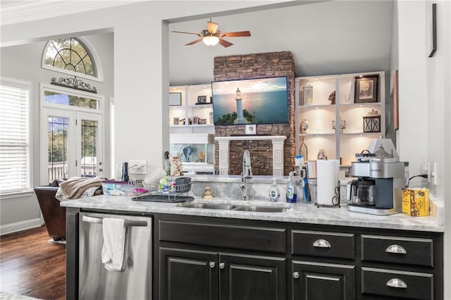 bar featuring stainless steel dishwasher, a sink, ceiling fan, and a wealth of natural light