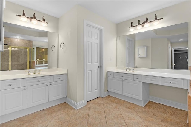 bathroom featuring vanity, tile patterned floors, and walk in shower