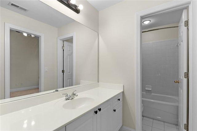 full bathroom featuring tile patterned floors, vanity, toilet, and bathing tub / shower combination