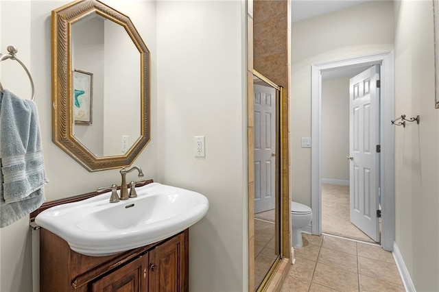 bathroom featuring toilet, tile patterned flooring, and sink