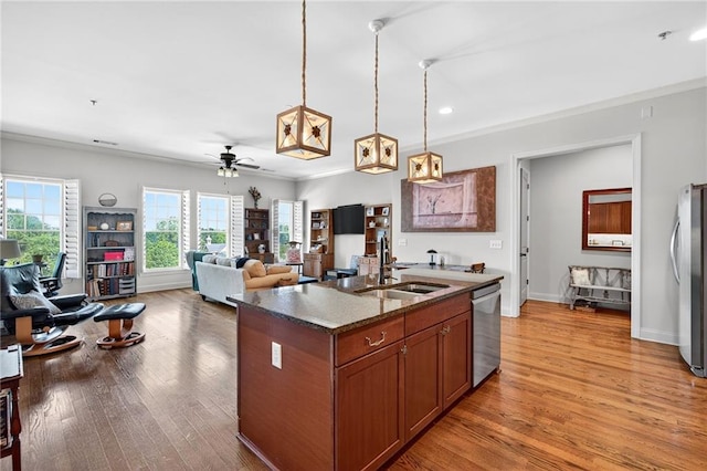 360 Chambers St Unit 402, Woodstock, GA 30188 - kitchen with stainless steel appliances, a ceiling fan, decorative light fixtures, light wood-style floors, and crown molding