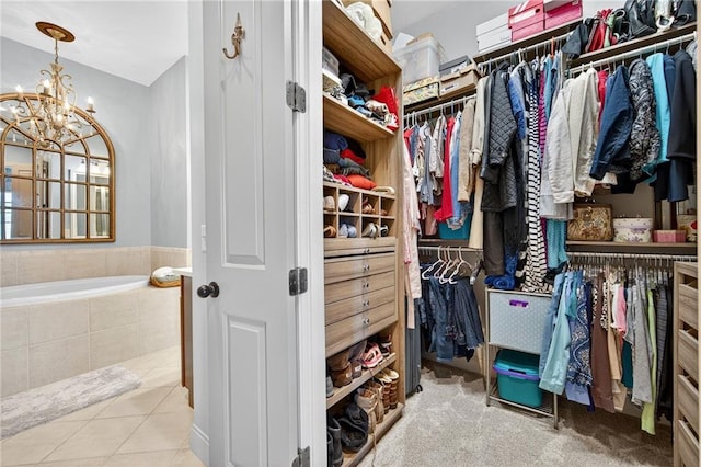 360 Chambers St Unit 402, Woodstock, GA 30188 - spacious closet with a chandelier and tile patterned floors