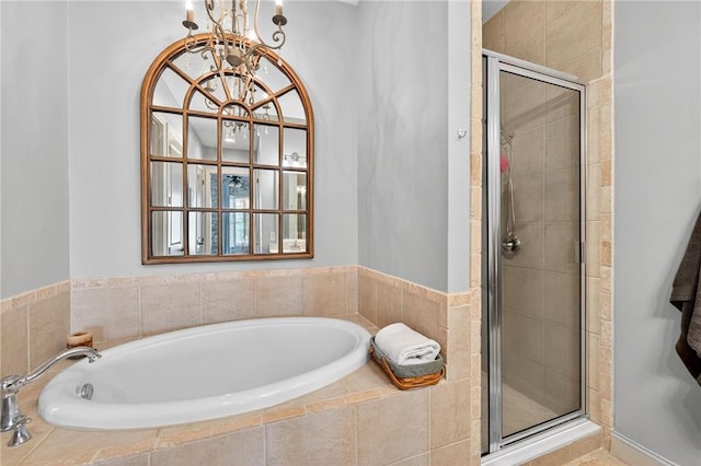 360 Chambers St Unit 402, Woodstock, GA 30188 - bathroom featuring a bath, a stall shower, and a chandelier