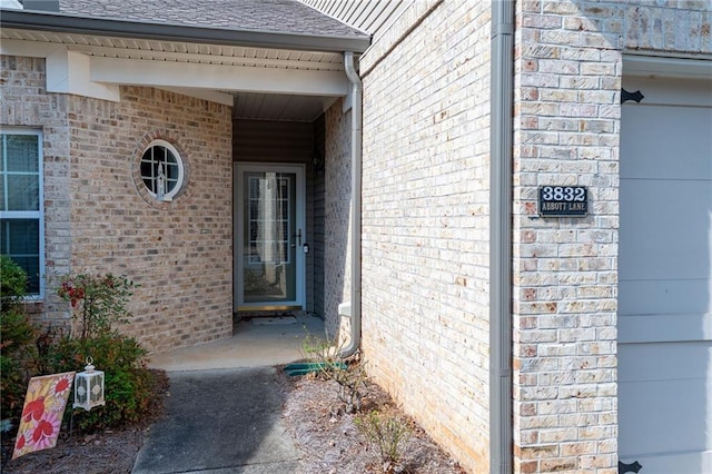 property entrance with brick siding