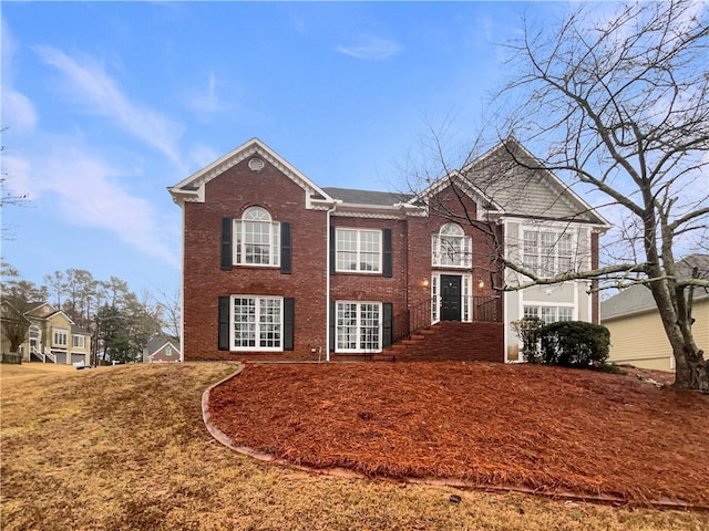 view of front of house featuring brick siding