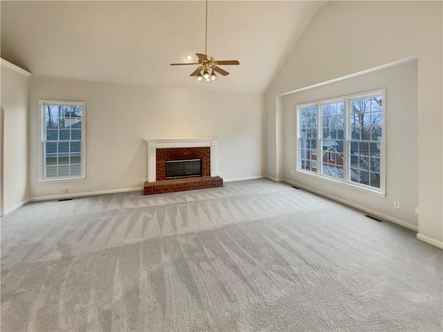 unfurnished living room with carpet, a fireplace, and baseboards