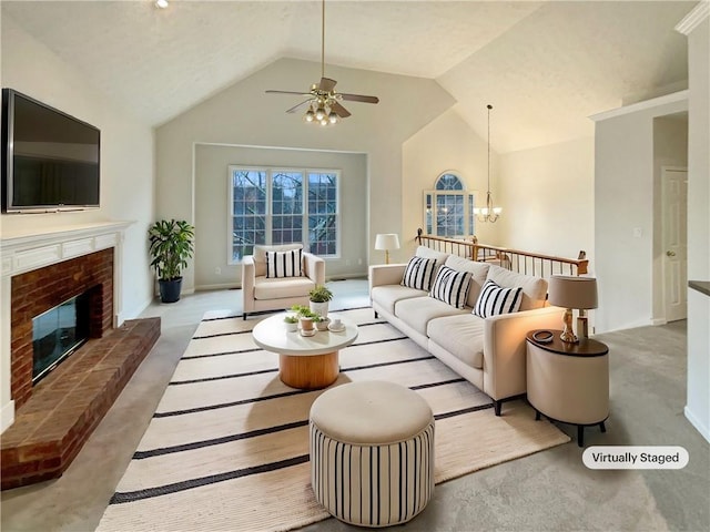 living room with baseboards, a brick fireplace, ceiling fan with notable chandelier, and vaulted ceiling