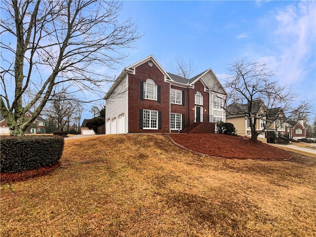 view of front of property with brick siding and an attached garage