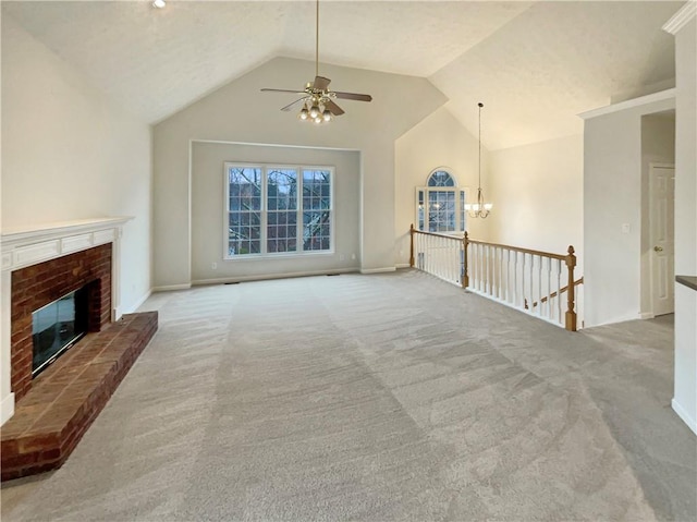 unfurnished living room featuring baseboards, carpet, a brick fireplace, and vaulted ceiling