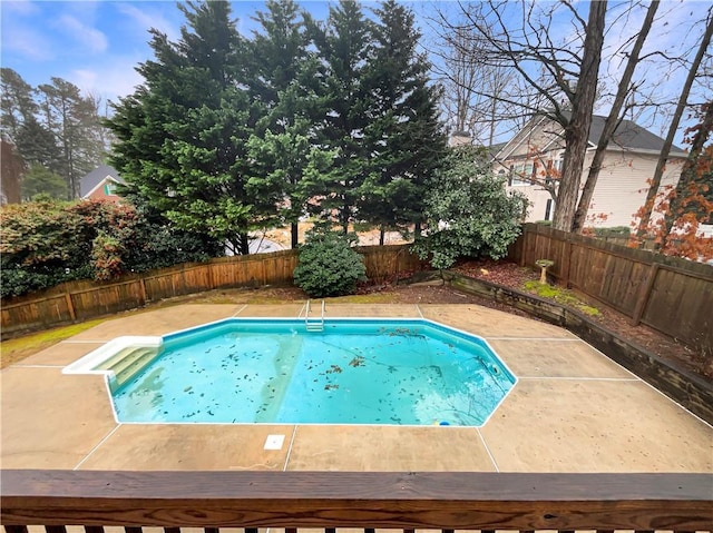 view of pool with a patio area and a fenced backyard