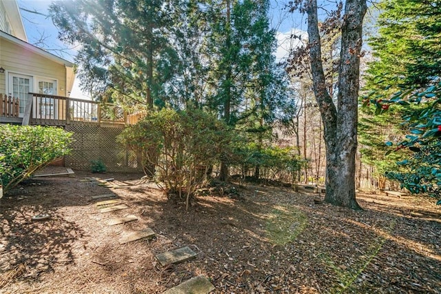 view of yard with a wooden deck