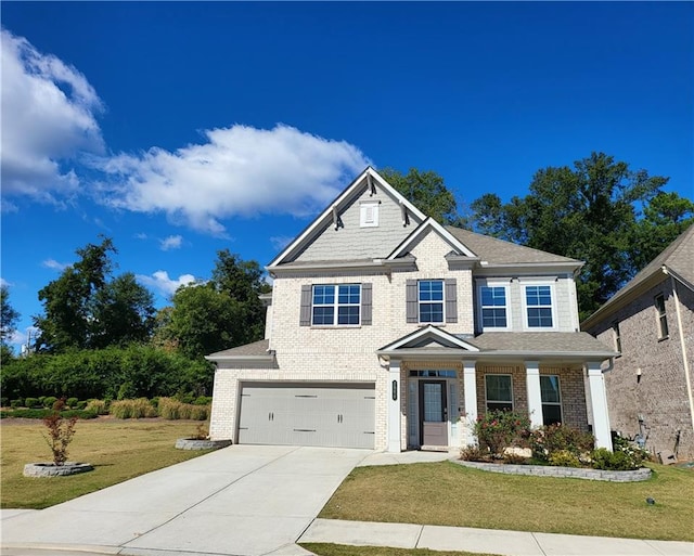 craftsman-style home featuring a front yard and a garage