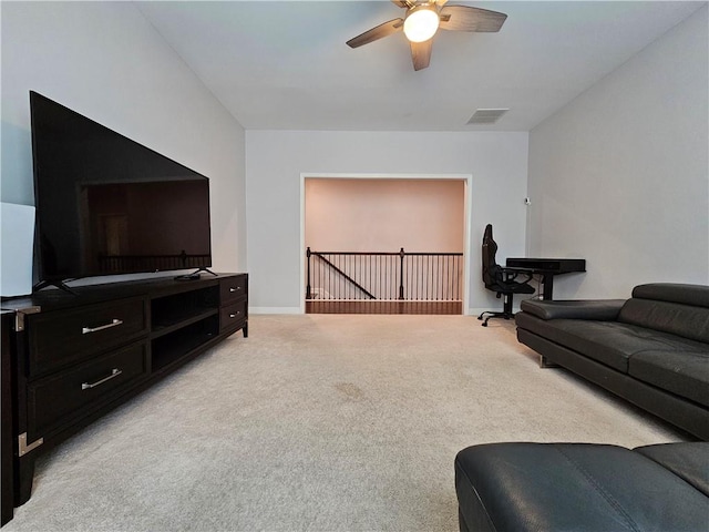 living room featuring ceiling fan and light carpet