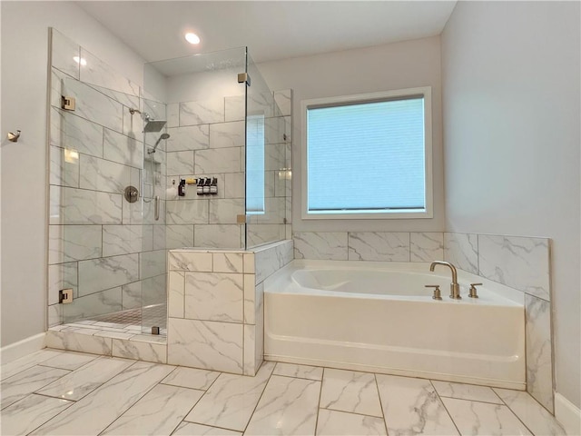 bathroom featuring separate shower and tub