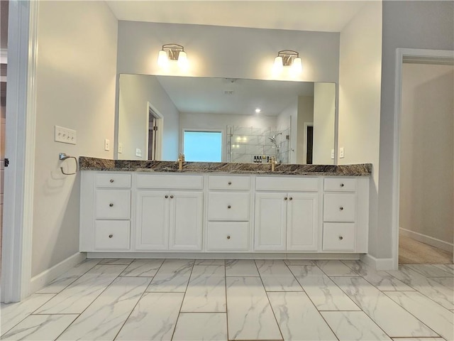 bathroom with an enclosed shower and vanity