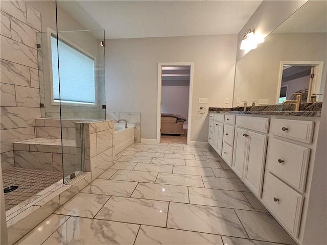 bathroom featuring vanity and separate shower and tub