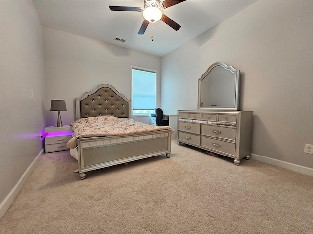 bedroom with ceiling fan, light colored carpet, and lofted ceiling