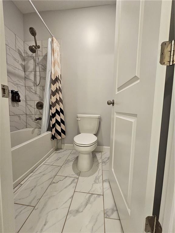 bathroom featuring shower / bath combination with curtain and toilet