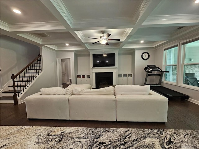 living room with dark wood-type flooring, ornamental molding, beamed ceiling, and coffered ceiling