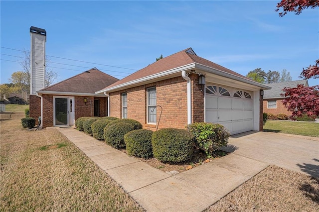 3264 Salem Cove Trl SE, Conyers, GA 30013 - view of side of home with a chimney, brick siding, driveway, and a yard
