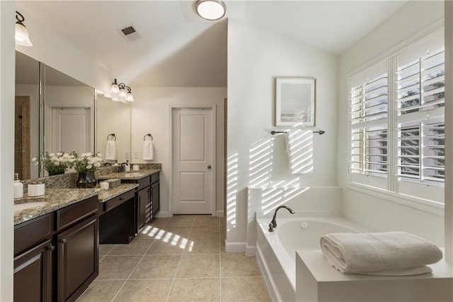 12380 Peyton Farm Way, Alpharetta, GA 30004 - full bath with tile patterned flooring, lofted ceiling, vanity, a garden tub, and baseboards