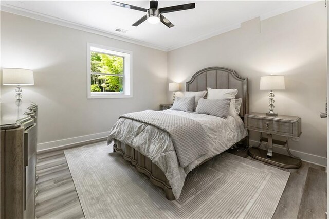 12380 Peyton Farm Way, Alpharetta, GA 30004 - bedroom featuring baseboards, crown molding, wood finished floors, and a ceiling fan