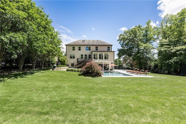 12380 Peyton Farm Way, Alpharetta, GA 30004 - rear view of house with stairway, a lawn, an outdoor pool, and a patio area