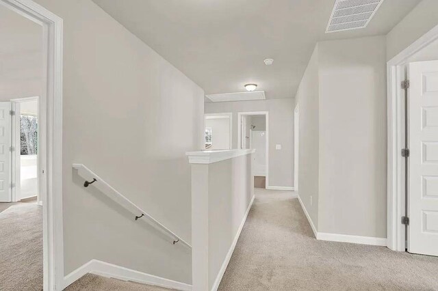 bathroom with toilet, baseboards, and wood finished floors