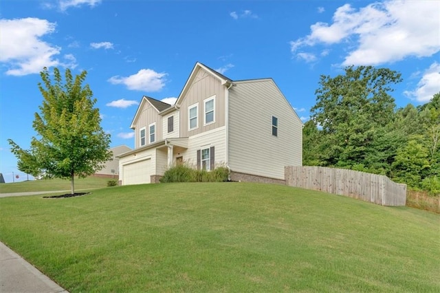 view of front of property with a garage and a front lawn