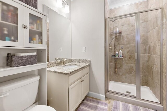 5910 Roxboro Ct, Cumming, GA 30040 - full bathroom featuring baseboards, vanity, toilet, and a shower stall
