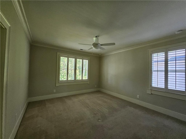 carpeted spare room featuring ceiling fan and crown molding