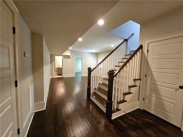 stairs with wood-type flooring