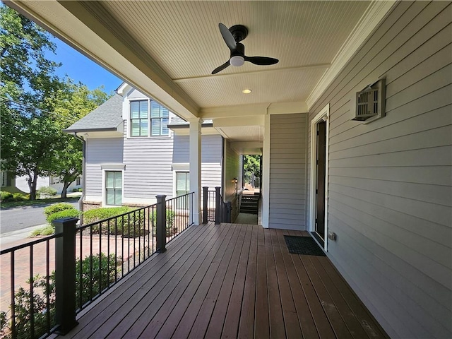 deck with ceiling fan and covered porch