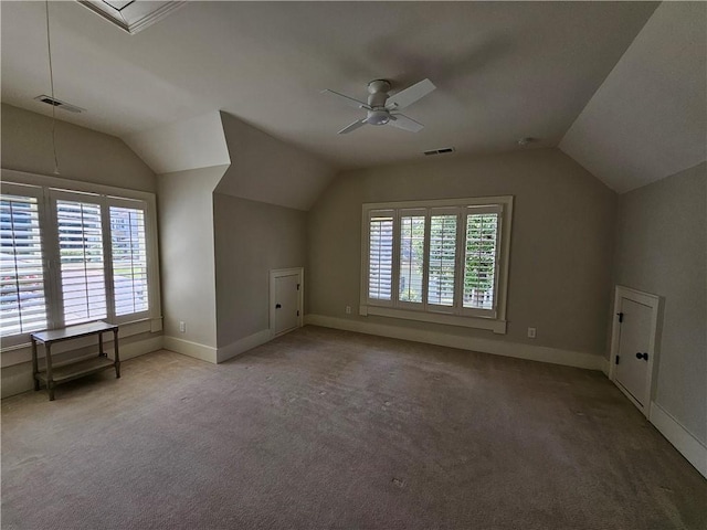 bonus room featuring ceiling fan, lofted ceiling, and carpet flooring