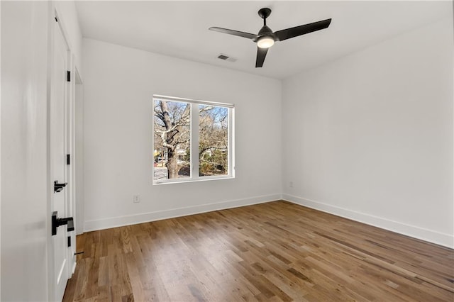 unfurnished room featuring hardwood / wood-style flooring and ceiling fan