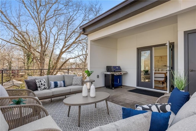 wooden terrace featuring a grill and outdoor lounge area