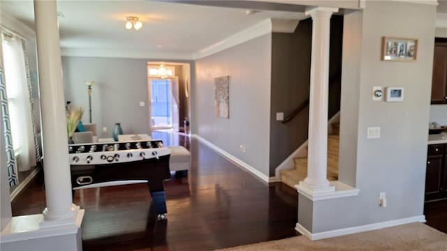 game room with baseboards, crown molding, and ornate columns